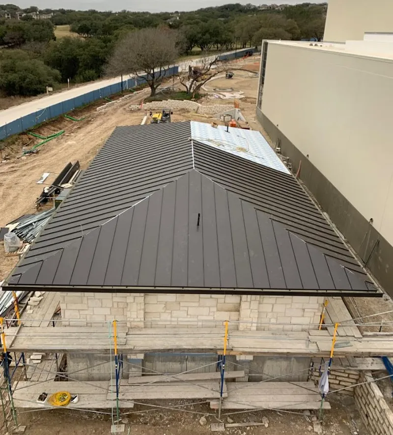 Metal roof new construction with scaffolding in Union Mill